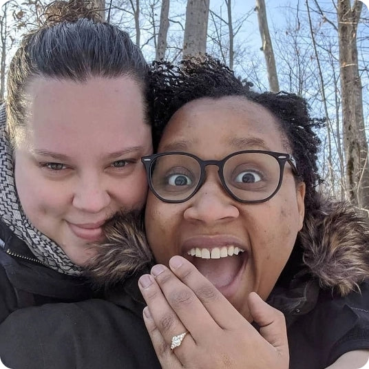 happy couple showing custom ring by Design by Sevan
